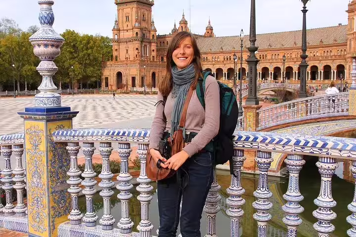 Traveler enjoying the view at Plaza de España, Seville, during a skip-the-line tour from Cadiz Port, perfect for cruisers.