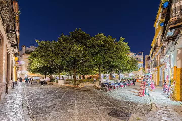 Charming Seville square illuminated at night, perfect for cruisers visiting Alcazar with skip-the-line access from Cadiz Port.