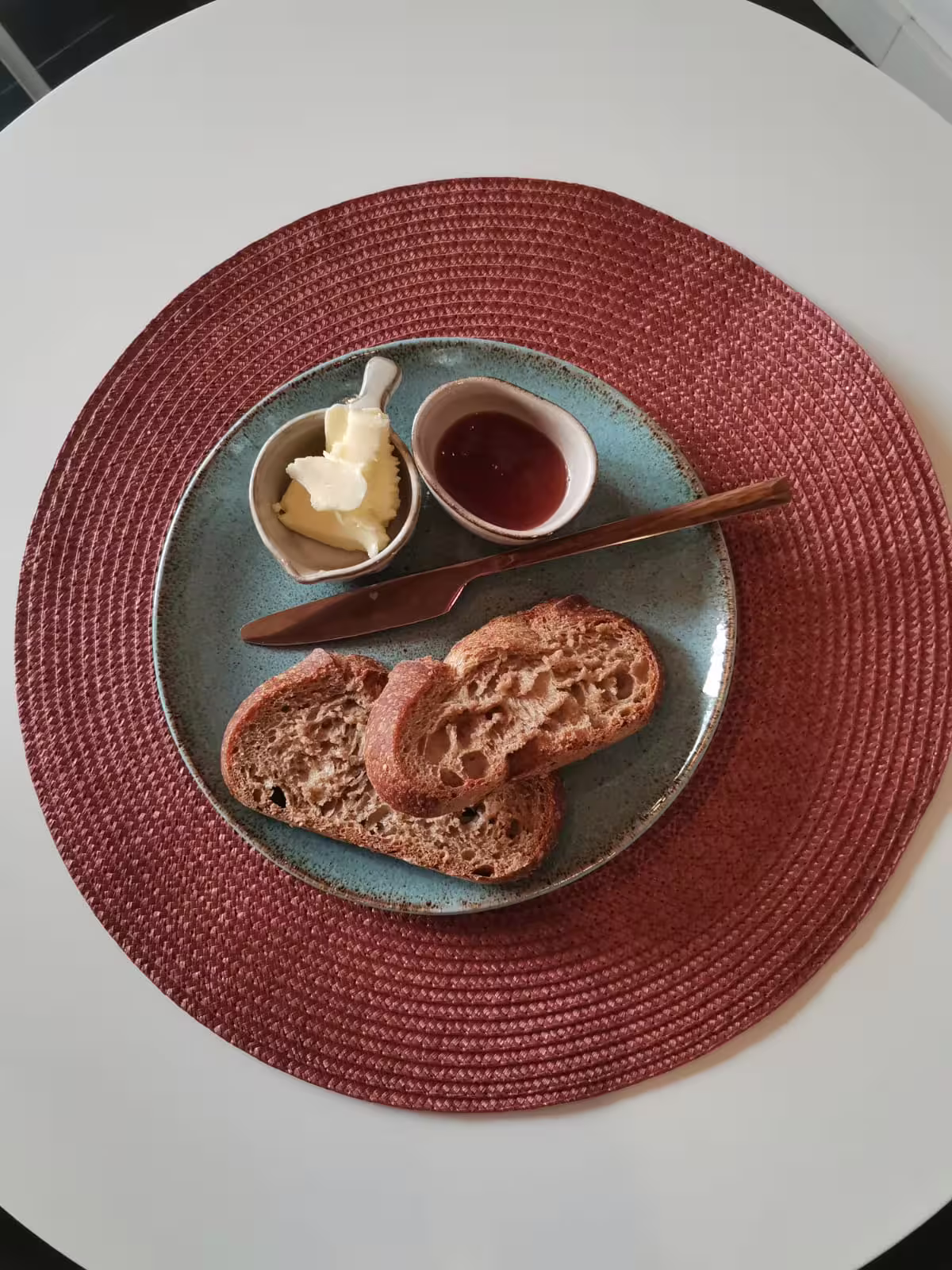 Savor a traditional Spanish breakfast with fresh bread, butter, and jam, featured on our Seville walking tour for small groups.