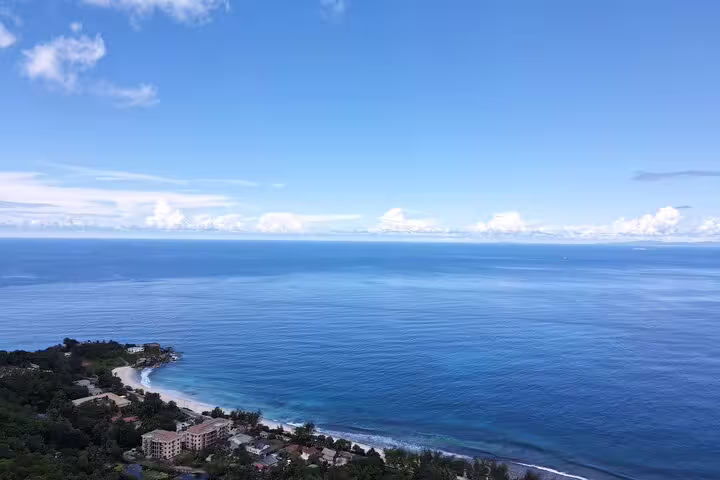 Breathtaking aerial view of Seychelles coastline, ideal for luxury transport services and scenic island tours.