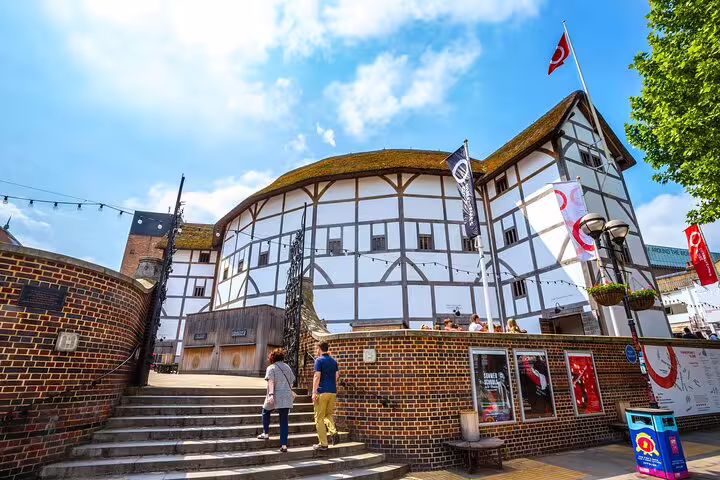 Visitors exploring the iconic Shakespeare's Globe Theatre in London, a highlight of the private tour through Camden Town and downtown markets.
