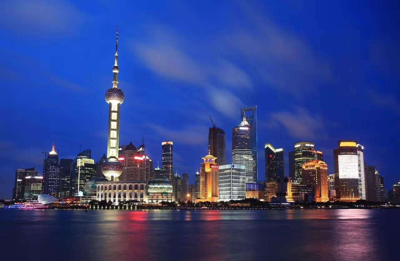 Shanghai skyline at night showcasing iconic skyscrapers on a private China Highlights tour.