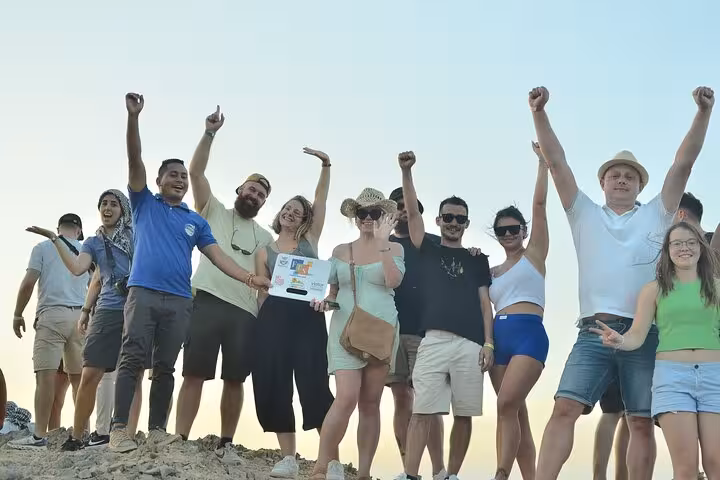 Group celebrating on Sharm El Sheikh desert safari, ATV quad biking and camel ride tour with BBQ dinner show