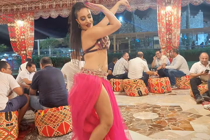 Belly dancer performing at Bedouin camp BBQ dinner show after Sharm El Sheikh ATV desert safari and camel ride