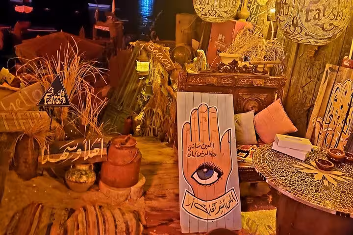 Cozy Sharm El-Sheikh cafe corner with Egyptian decor, low table seating, included shisha and drink