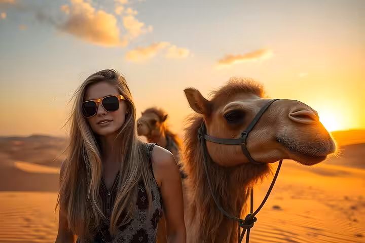 Camel riding in Sharm El-Sheikh Sinai desert at sunset, guest with camel before BBQ dinner and Bedouin show