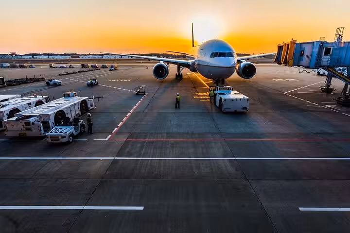 Airplane on the runway at sunrise for Sharm El Sheikh to Luxor flight, ideal for a full-day Luxor tour by plane