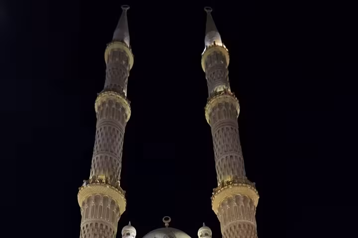 Illuminated mosque minarets at night in Sharm El Sheikh Old Market on a private guided tour