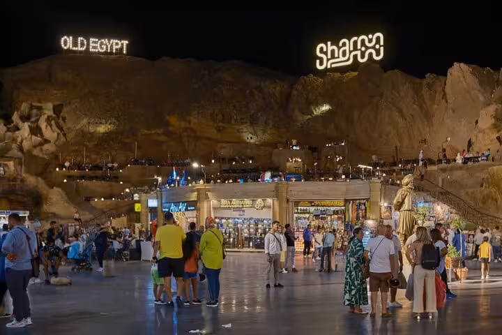 Night view of Old Market Sharm El-Sheikh with crowds and illuminated signs on guided city tour