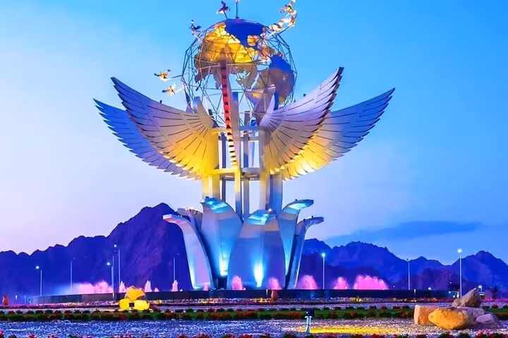 Illuminated Peace Square wings monument in Sharm El Sheikh on shared city tour with shopping and stops