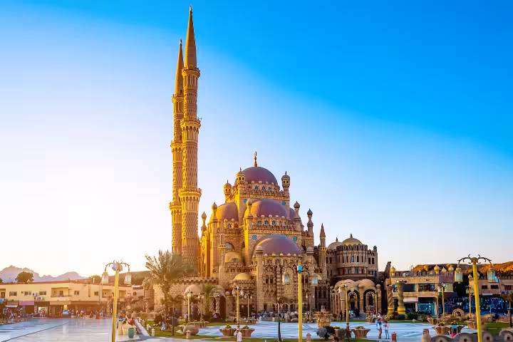 Sharm El Sheikh private airport transfer to hotel with air-conditioned car, scenic city mosque landmark view