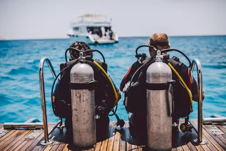 Divers gearing up on boat in Sharm El-Sheikh for Ras Mohammed and White Island intro dive in Red Sea