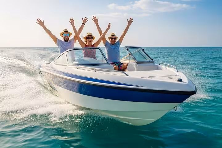 Happy travelers on a Sharm El Sheikh speed boat, Red Sea, enjoying a 2-hour ride with sea spray and open-water views