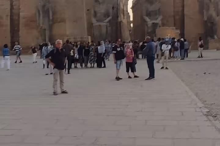 Crowds exploring Luxor Temple courtyard during Sharm El Sheikh to Luxor day trip by plane with group