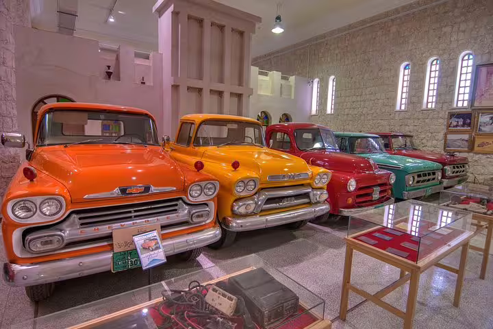 Vibrant vintage cars on display at Sheikh Faisal Museum, highlighting Qatar's rich automotive history.