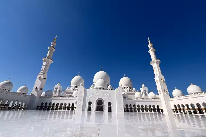 Sheikh Zayed Grand Mosque Abu Dhabi on Dubai to Abu Dhabi multi-day tour, white domes and minarets