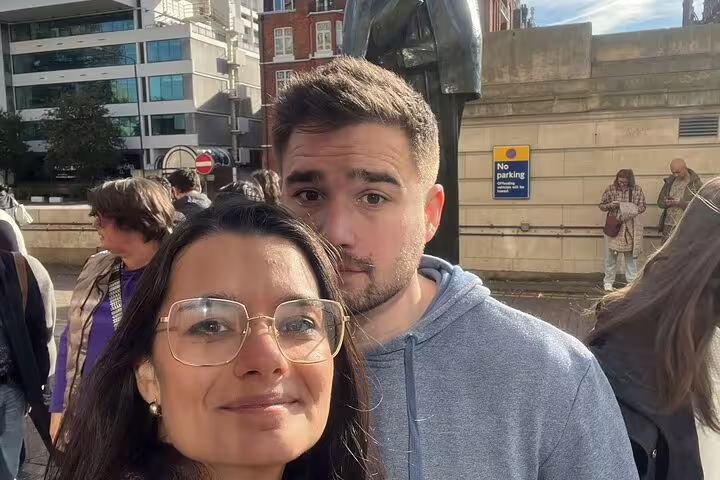 Two visitors posing for a selfie during a Sherlock Holmes walking tour in London city centre