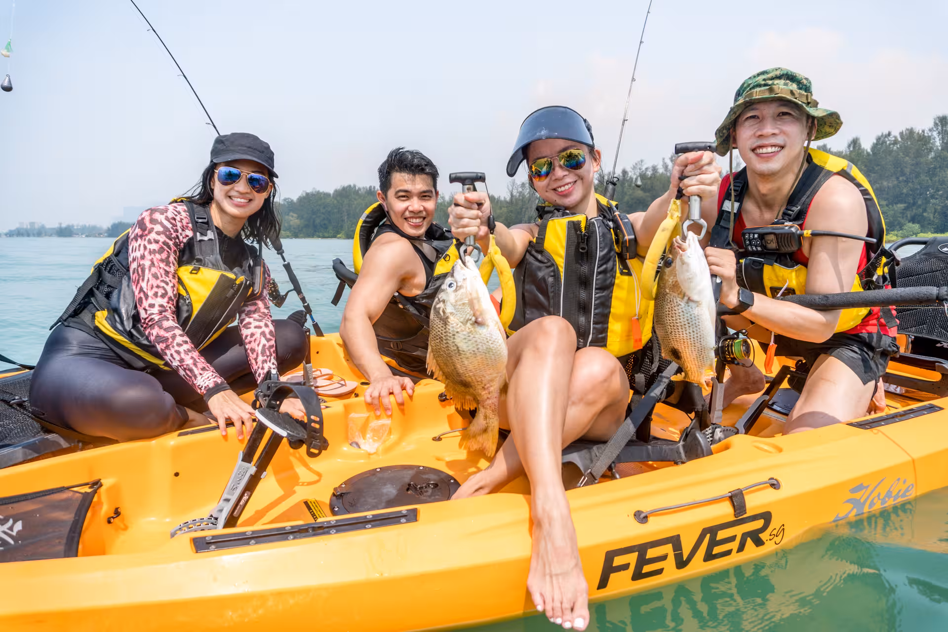 Group of kayakers displaying their catch during a sunny day of fishing at Shipwreck Bay Marine East adventure.