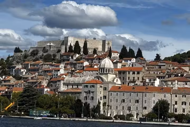 Historic Šibenik old town with cathedral dome and hilltop fortress overlooking the Adriatic Sea, Croatia