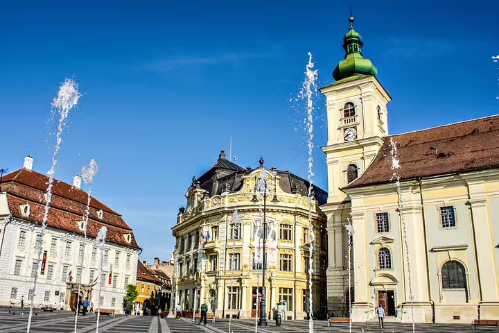 Baroque buildings and fountains at Sibiu's Grand Square in Transylvania, Romania