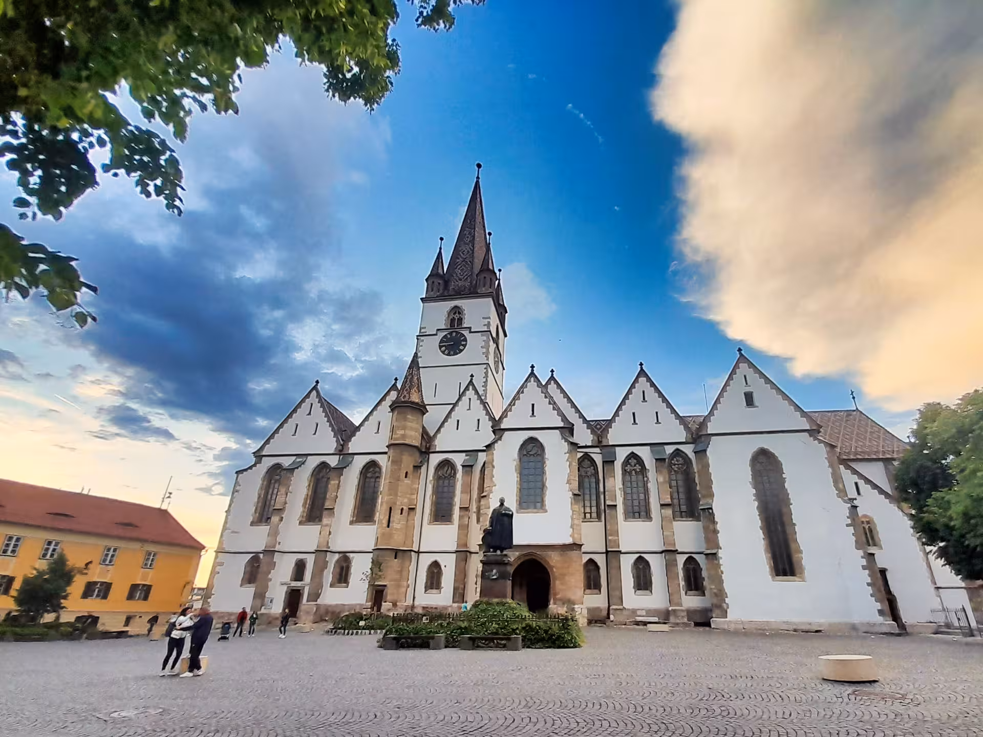Lutheran Cathedral of Saint Mary in Sibiu's main square with Gothic architecture and clock tower