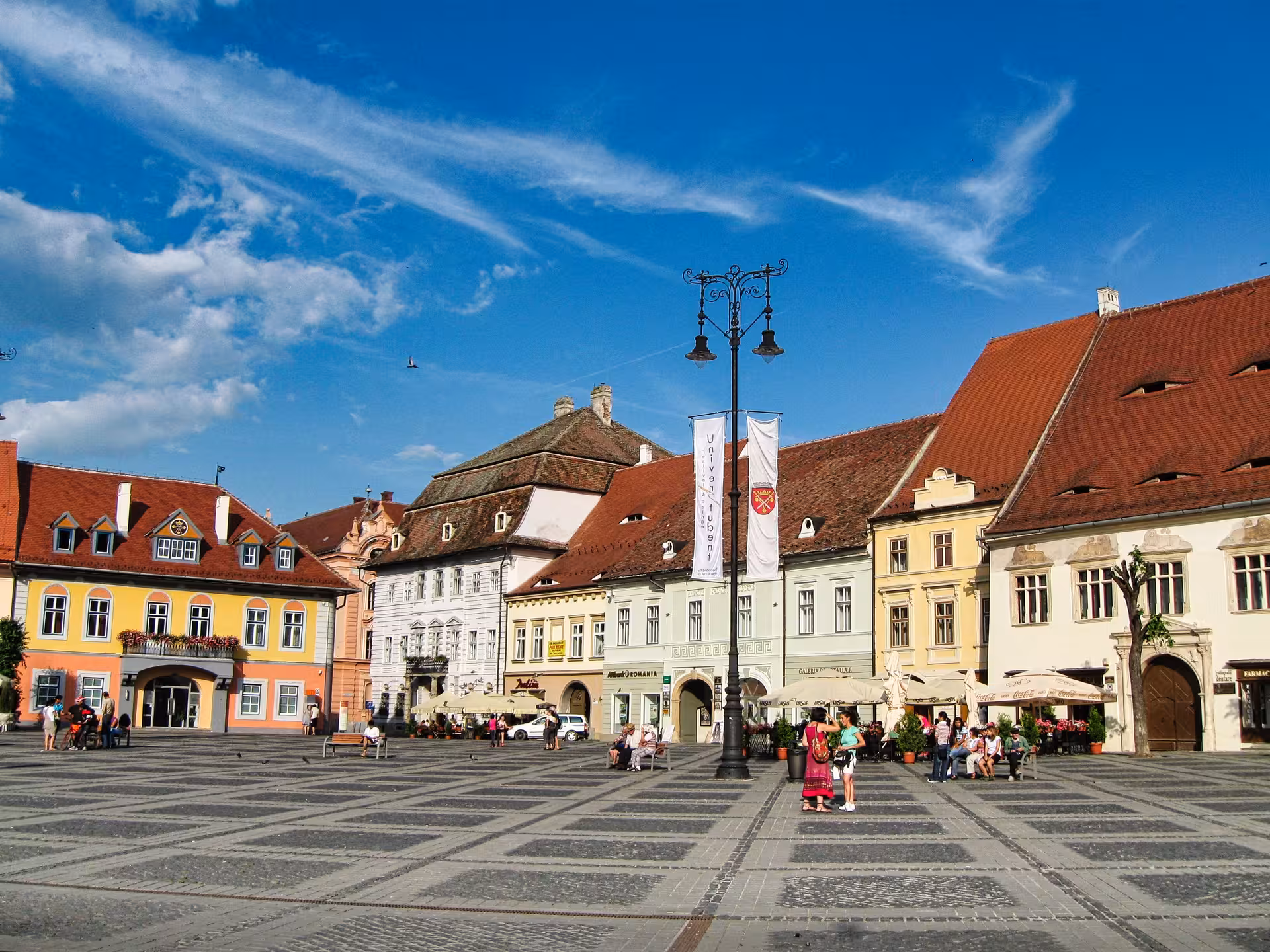 Piața Mare main square in Sibiu Romania with colorful historic buildings and cobblestone plaza