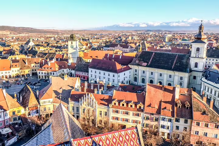 Aerial view of Sibiu medieval old town with red rooftops and church towers, Transylvania, Romania