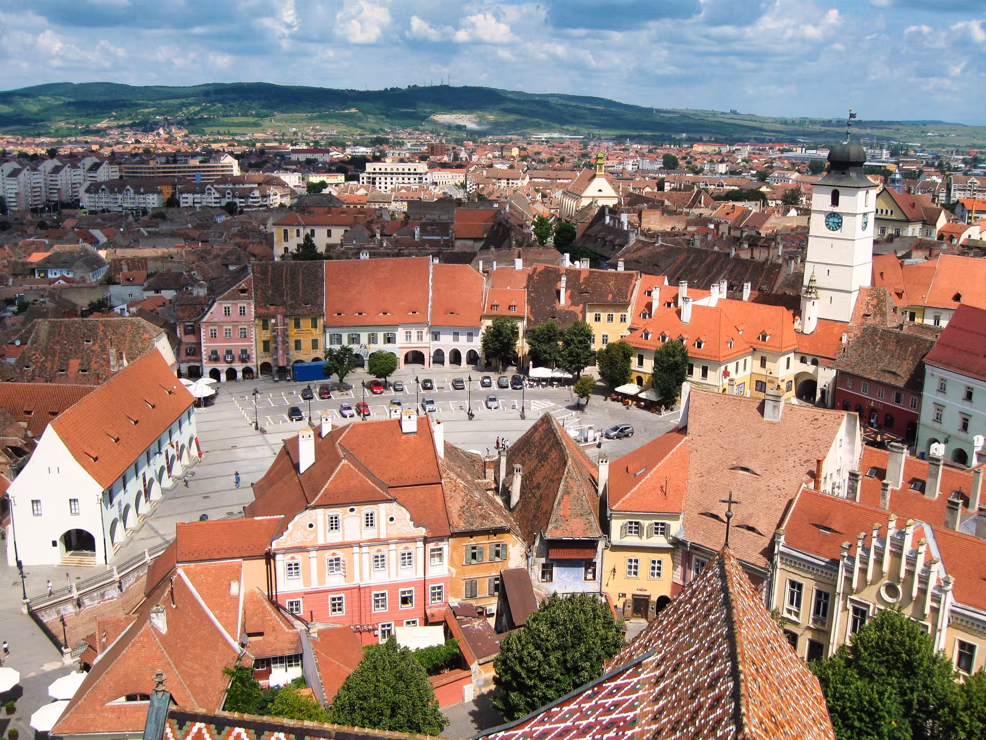 Aerial panoramic view of Sibiu old town red rooftops and Council Tower on a Transylvania day trip