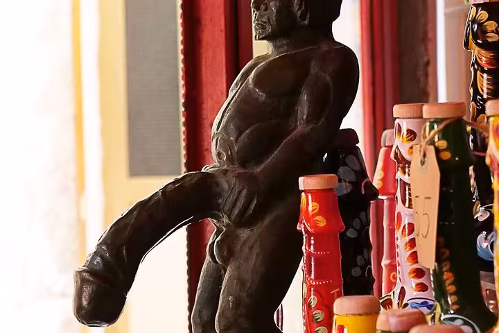 Traditional Sicilian ceramic figurines and colorful pottery displayed in a shop in Taormina.