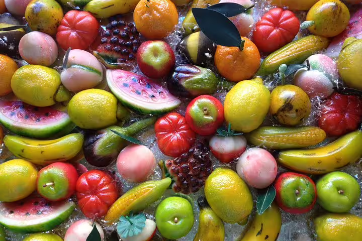 Colorful Sicilian marzipan fruits on display in Palermo, a sweet stop on the Monreale and Mondello full-day tour