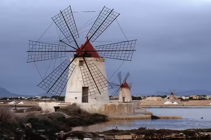 Traditional Sicilian salt mill windmill near Trapani, scenic stop on Erice and Segesta tour from Palermo