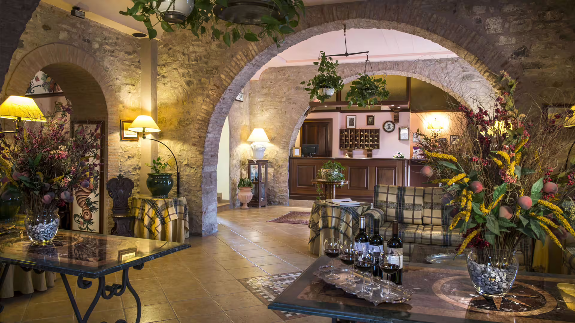 Rustic Sicilian wine tasting lounge with local bottles, part of Cefalù and Castelbuono tour wine experience