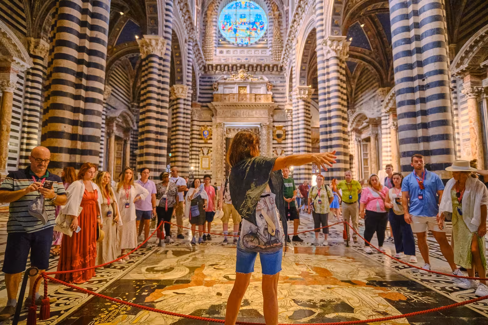 Tour group exploring the stunning interior of Siena Cathedral on Tuscany Highlights Guided Tour from Florence.