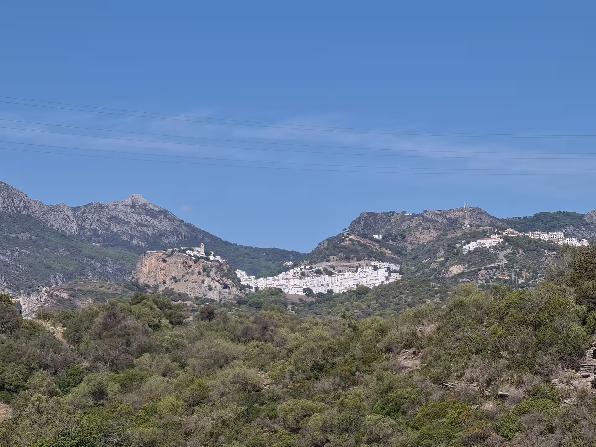 Enjoy panoramic views of whitewashed villages nestled in the Sierra de la Utrera mountains during your hiking adventure.