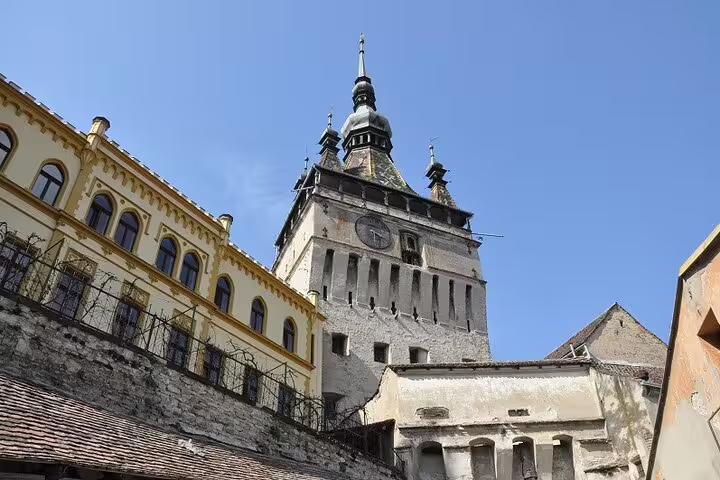Clock tower and medieval buildings of Sighișoara citadel in Transylvania, Romania
