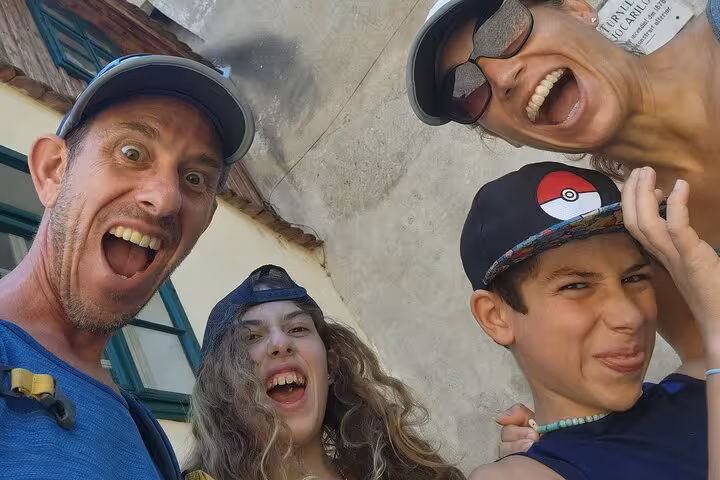 Happy family taking a fun selfie during a walking tour in Sighisoara fortress