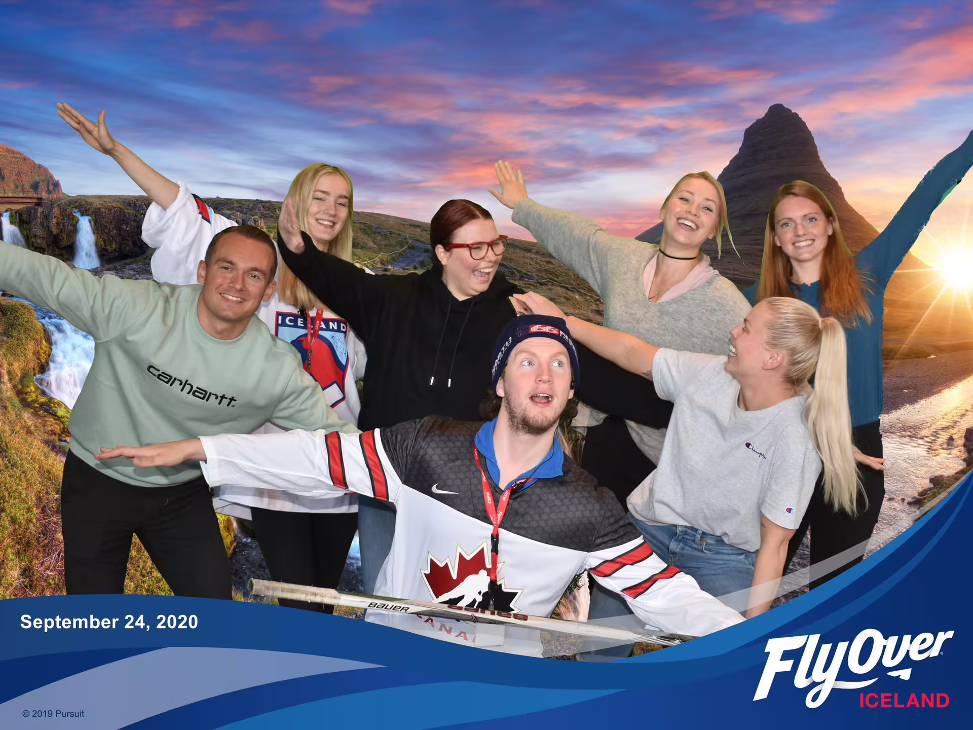 Group enjoying Iceland's scenic beauty at FlyOver Iceland with Silfra snorkeling tour backdrop, perfect for adventure seekers.