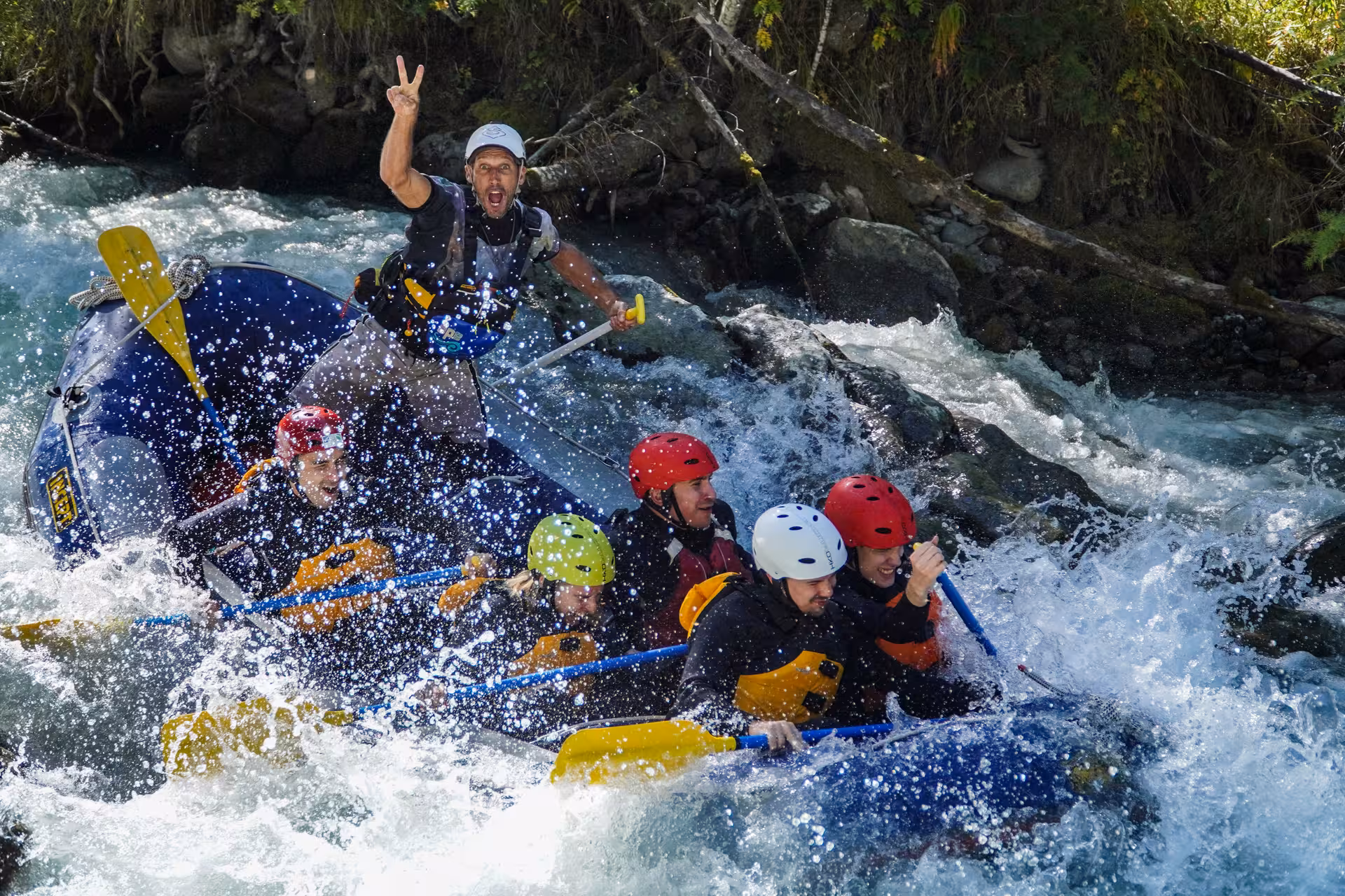 Excited group rafting through dynamic Simme River rapids, perfect for adventure seekers and family fun.
