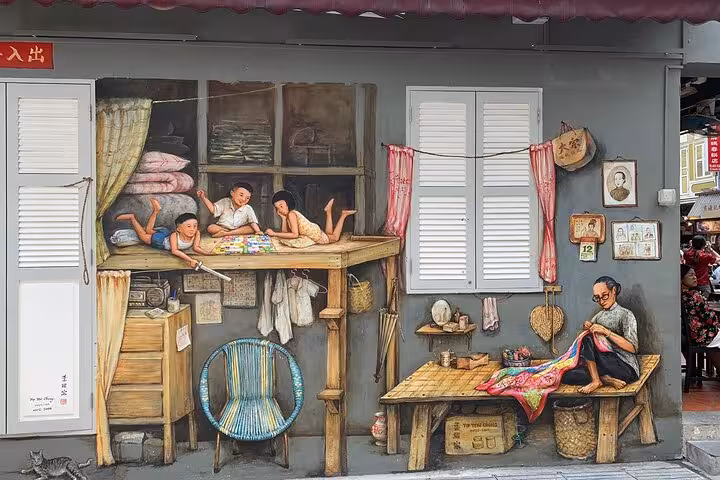 Chinatown mural in Singapore depicting an intricate family scene with children playing and a man sewing.