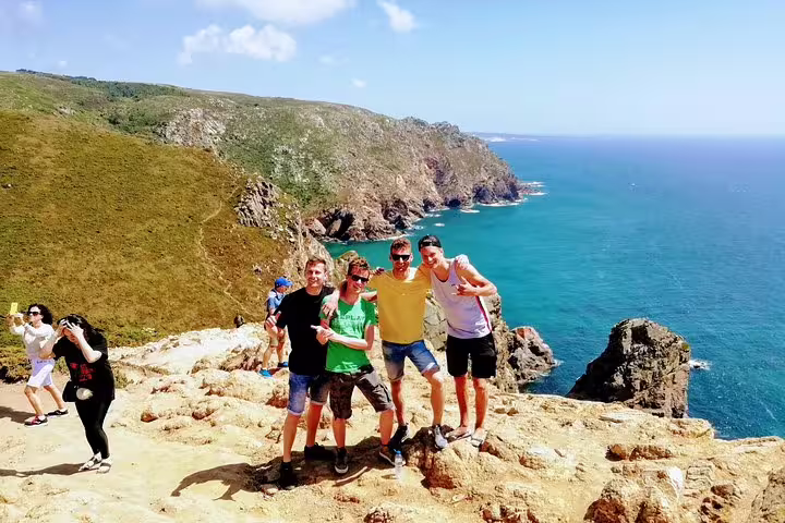 Group enjoying stunning coastal views on Sintra World Heritage and Cascais Village private luxury tour.