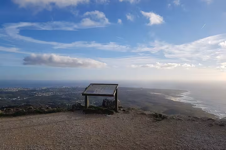 Panoramic coastal view from a viewpoint on the Sintra and Cascais tour, showcasing the vast landscape and ocean.