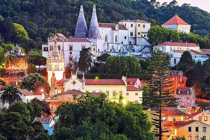 Scenic view of Sintra's historic architecture and lush greenery, highlighting the charm of a private customizable tour in Portugal.