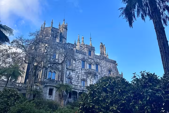 Majestic Sintra palace surrounded by lush gardens, a highlight of the 007 private tour along Portugal's Atlantic coast.