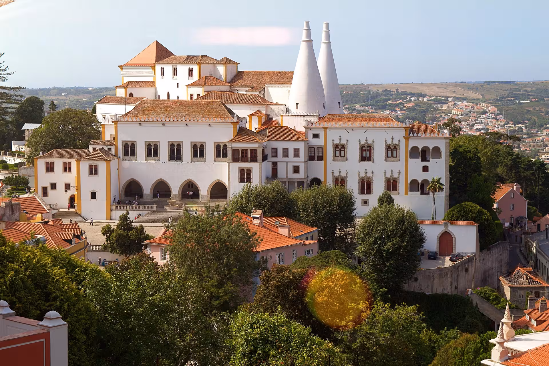 Aerial view of Sintra National Palace with iconic twin chimneys on a private e-bike palaces tour