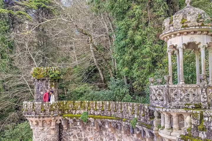 Explore the enchanting stone structures and lush greenery on a private Sintra tour with monument tickets from Lisbon.