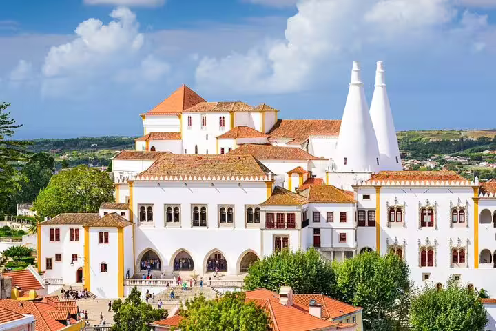 The majestic National Palace of Sintra with iconic chimneys, a highlight on the Lisbon guided day tour.