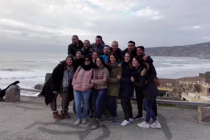 Group enjoying scenic views at Cabo da Roca during a Sintra, Roca, and Cascais private full-day tour in Portugal.