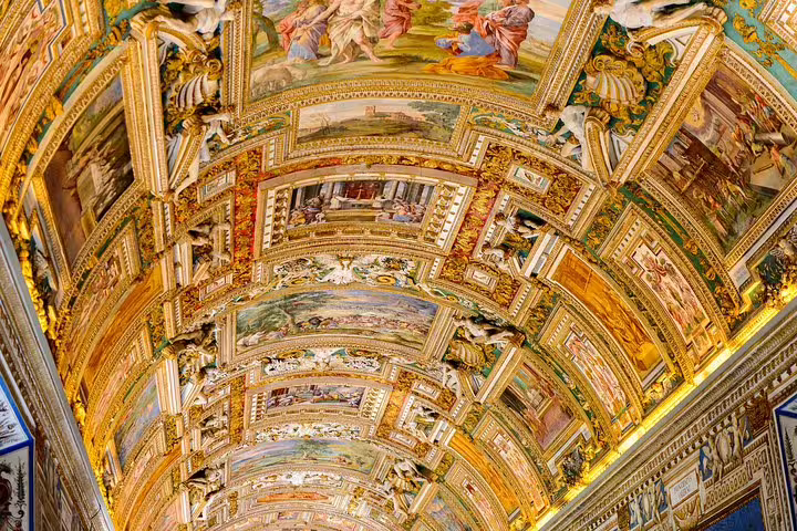 Golden vaulted ceiling with Renaissance frescoes in the Vatican Museums seen on an exclusive Sistine Chapel fast track entrance tour