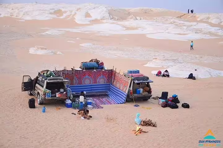 4x4 desert camp in Siwa Oasis dunes with Bedouin tent, gear and campfire on a 5 days 4 nights tour