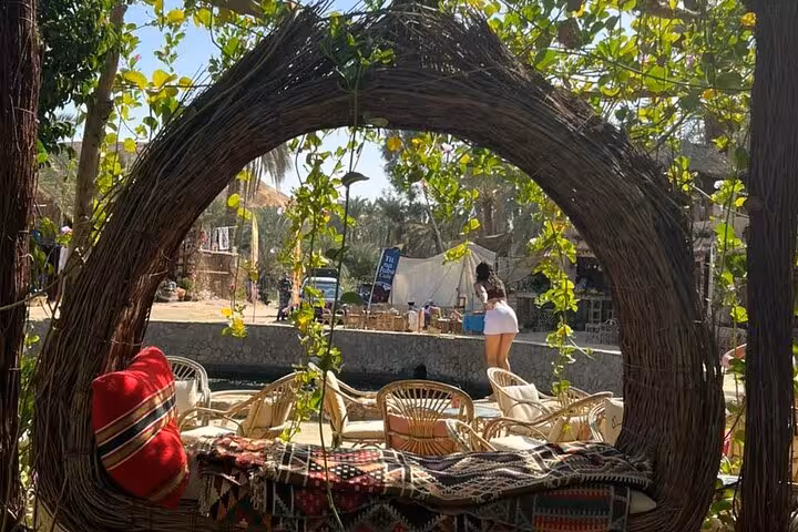 Rustic woven lounge arch at a Siwa Oasis desert camp, perfect stop on a 3-day Sahara safari with salt lakes
